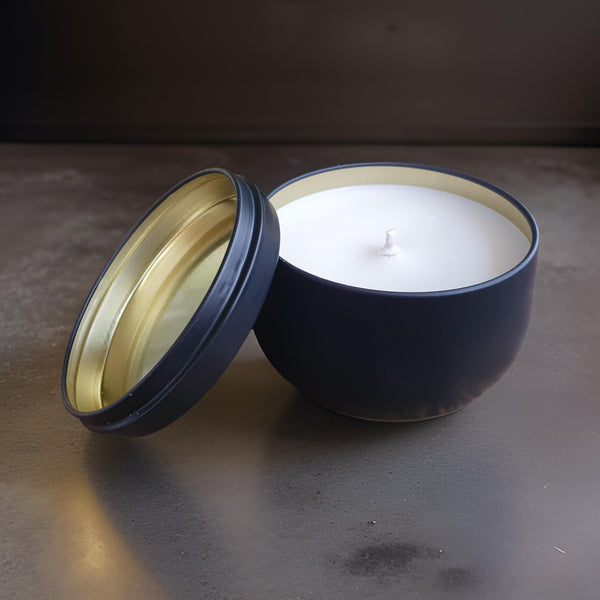 candle in black tin