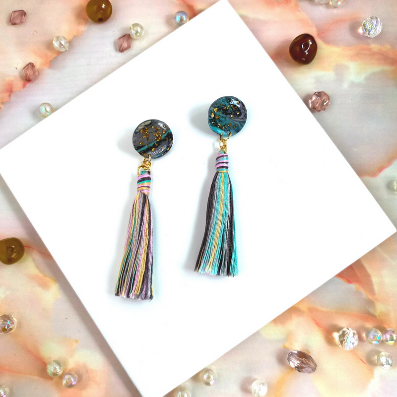 Handmade in our West Yorkshire Studio, these unique, one-of-a-kind faux marbled polymer clay earrings with tassel charm are the perfect gift for any stylish women.