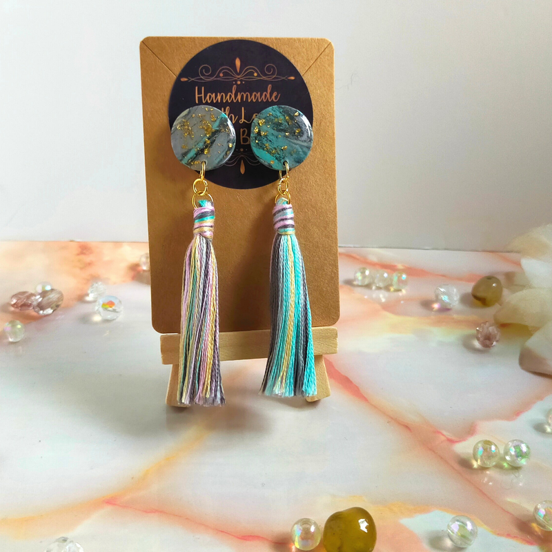 Handmade in our West Yorkshire Studio, these unique, one-of-a-kind faux marbled polymer clay earrings with tassel charm are the perfect gift for any stylish women.