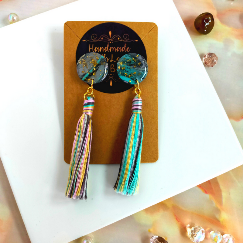 Handmade in our West Yorkshire Studio, these unique, one-of-a-kind faux marbled polymer clay earrings with tassel charm are the perfect gift for any stylish women.