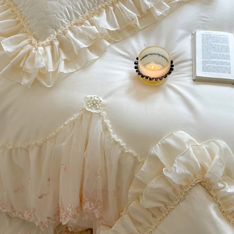 Floral lace with pearl center, white-and-pink embroidery, sheer scalloped trim — 100% cotton — modern bedroom