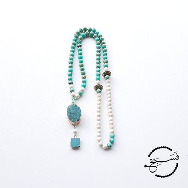 These sea sediment beads are the most gorgeous shade of turquoise! They look especially striking when paired with the beige beads.  We've used a druzy pendant and a mini amazonite pendant to finish off this tasbih.  Packaged in a luxurious pouch and gift box.  99 beads
