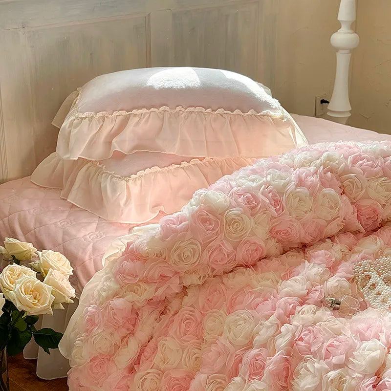 Blush pink luxury bedding set with quilted rose-accented sheet, velvet shams, and lace trim — romantic and elegant interiors.
