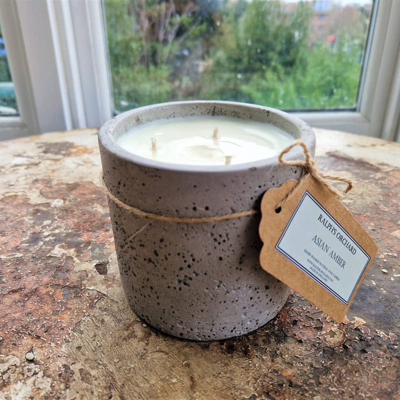 candle in cement pot