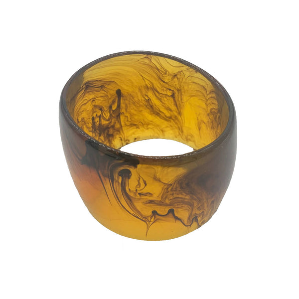 Vintage transparent brown Bakelite bangle accessory with fluid artistic pattern