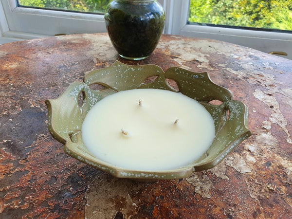 green ceramic flower shaped bowl candle with 3 wicks