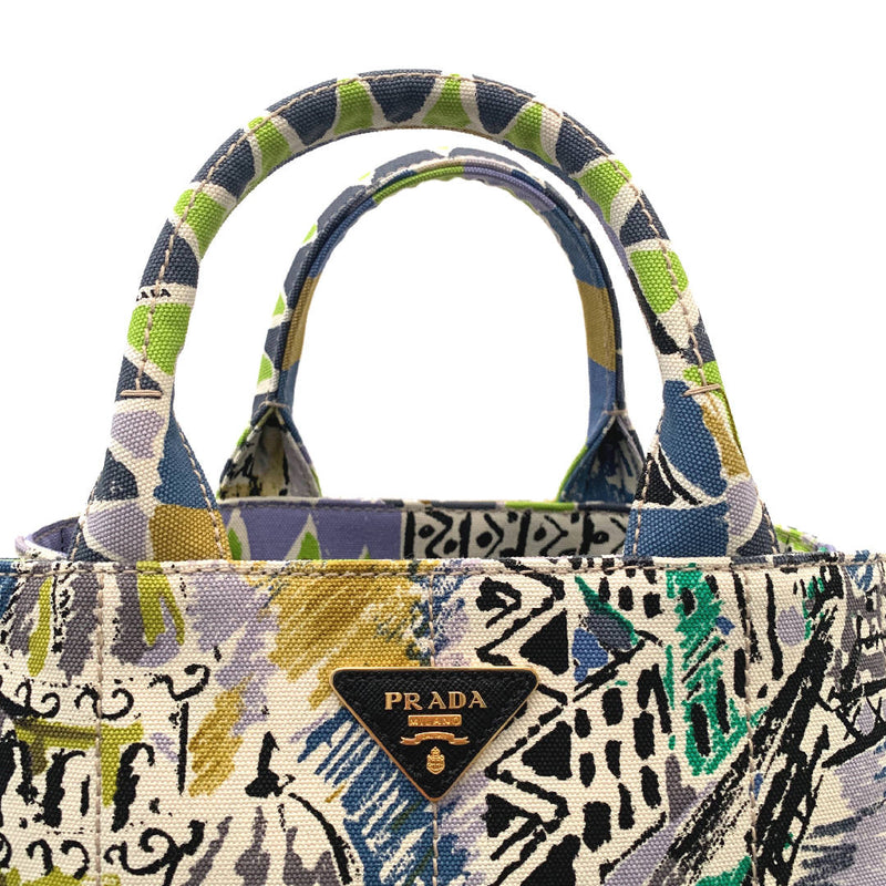 A new PRADA Cityscape Limited Edition Canapa woven graphic printed tote handbag with handles and detachable strap