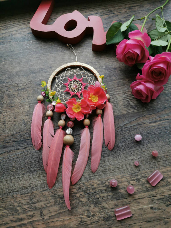 Pink dream catcher is an ideal home decoration that can be hung in a bedroom, nursery, or any other room.