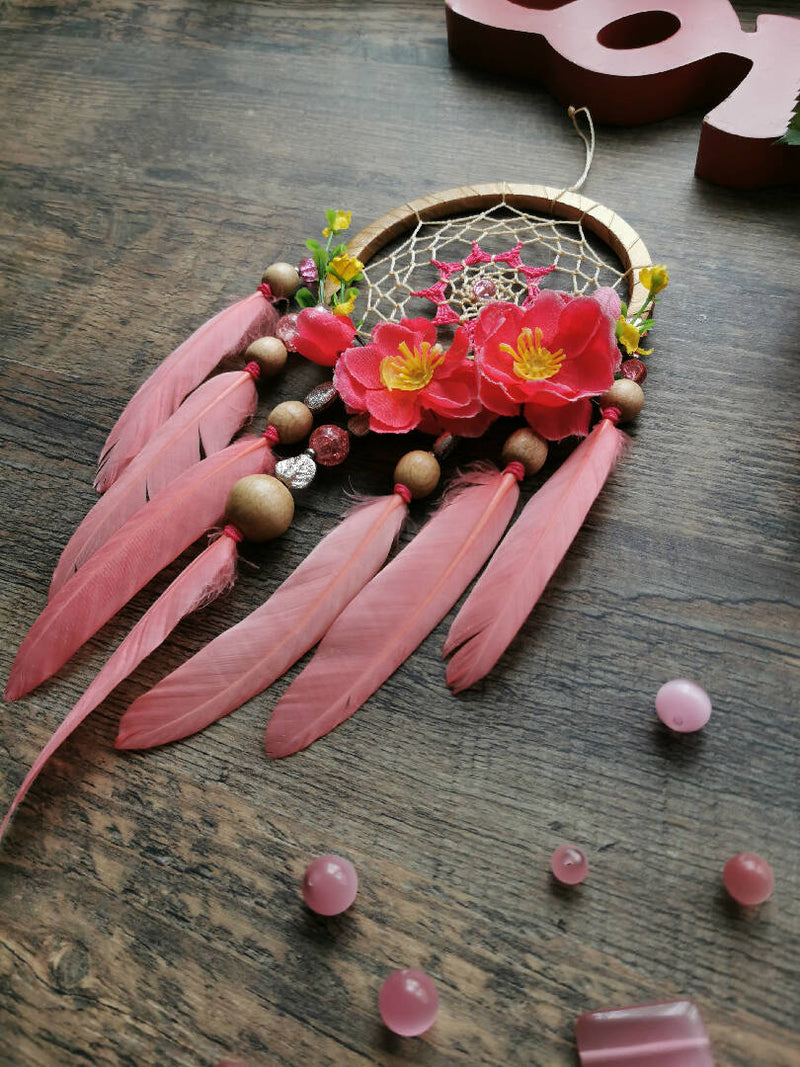 Pink dream catcher is an ideal home decoration that can be hung in a bedroom, nursery, or any other room.